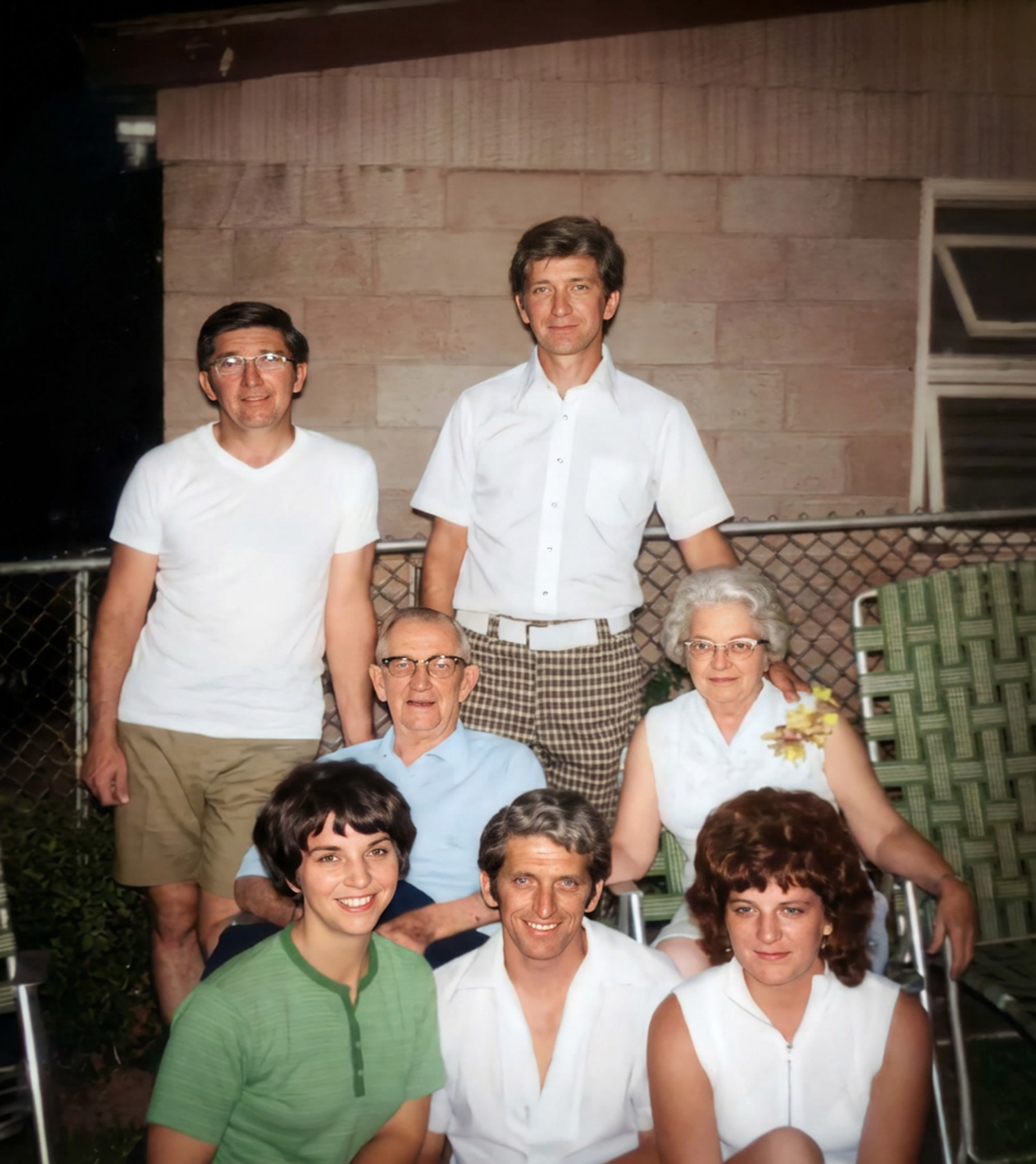 The restored family patio portrait with clear faces and balanced natural color